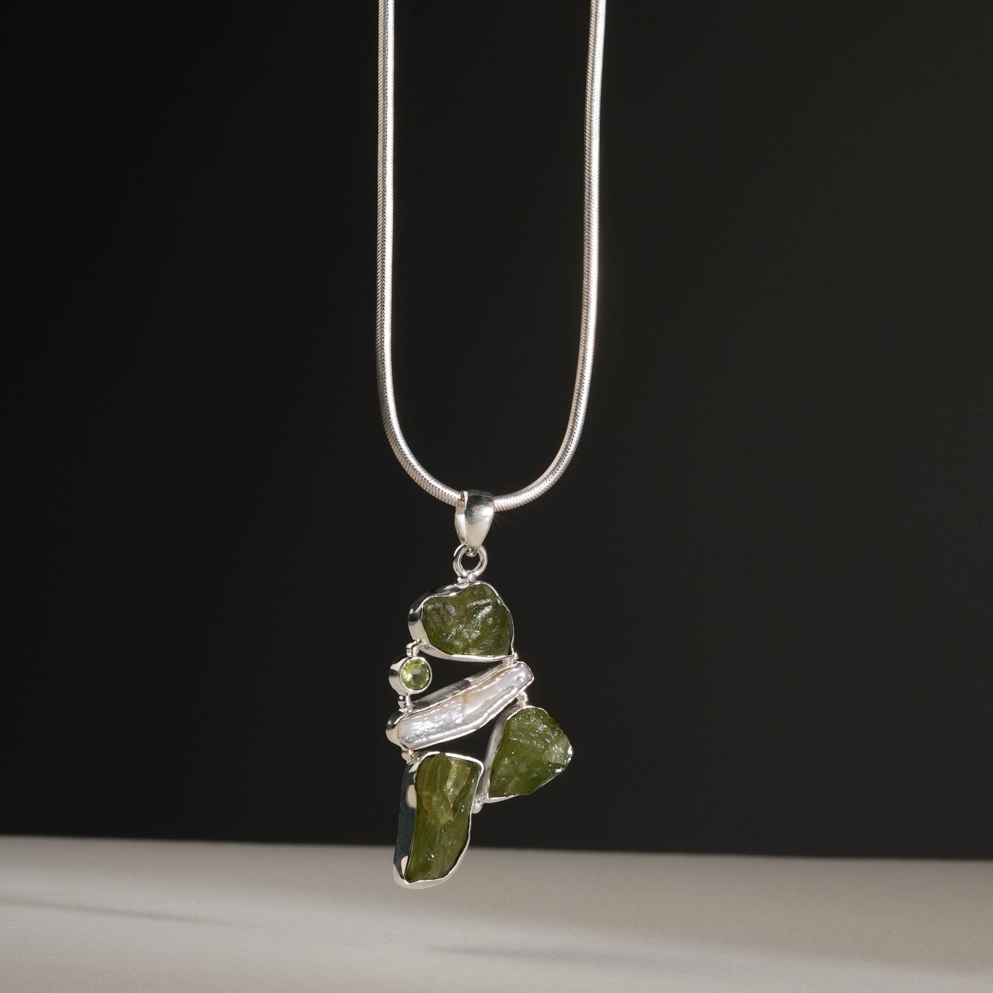 Elegant Silver Pendant with Peridot Stone