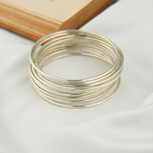 Set Of Dozen Silver Bangles