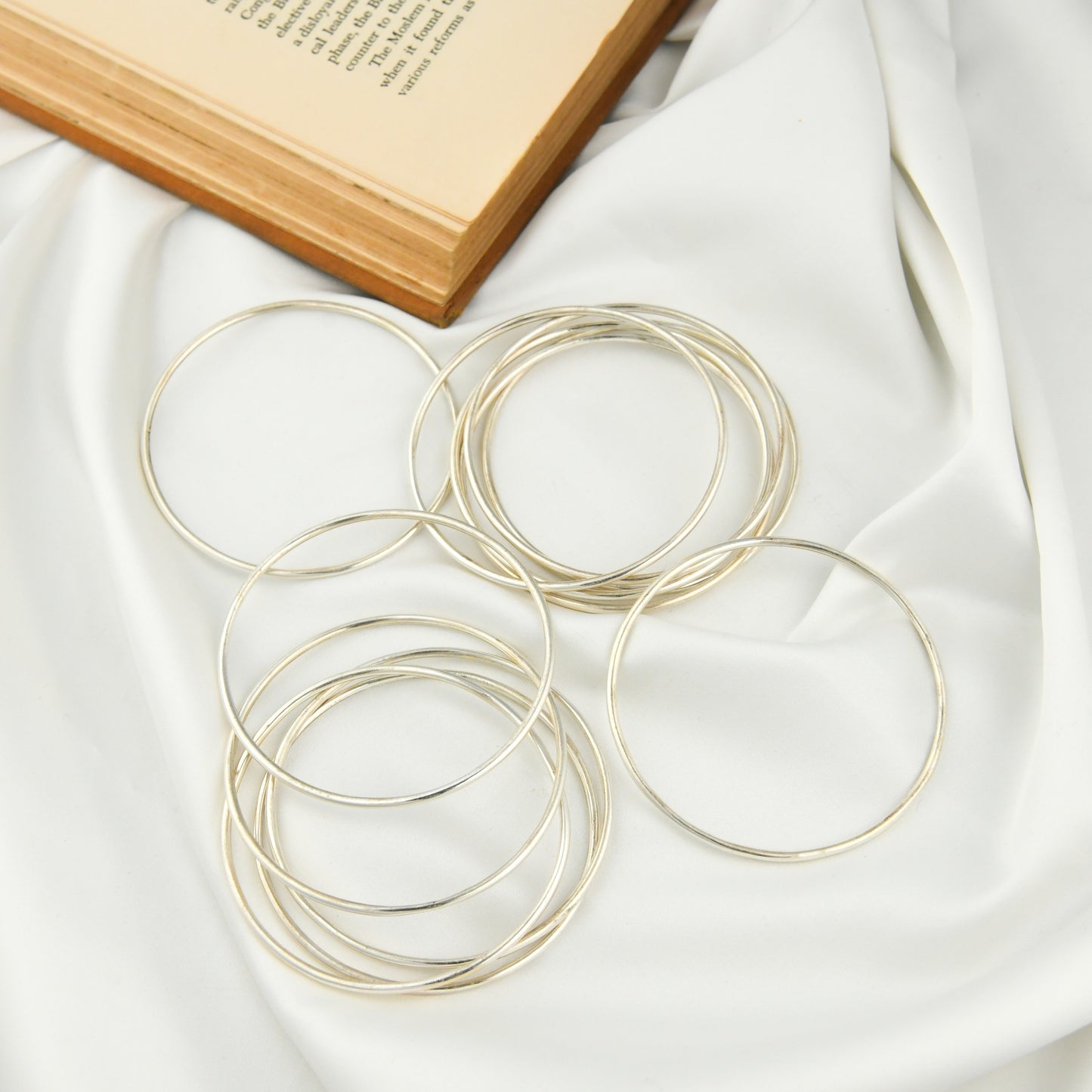 Set Of Dozen Silver Bangles