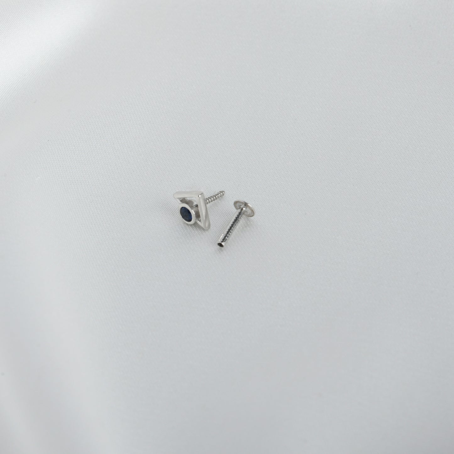 Trikone Blue CZ Silver Nose Pin