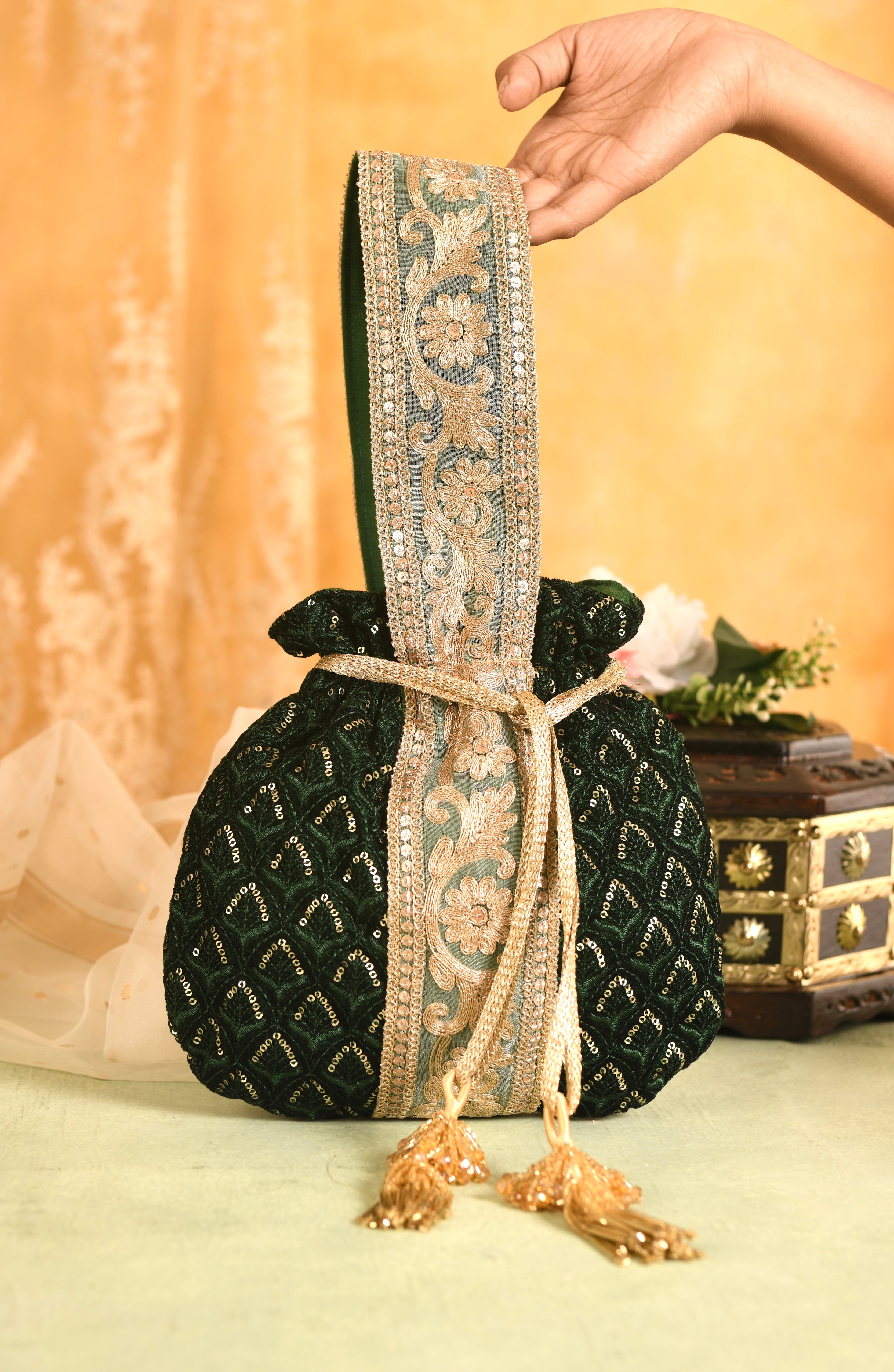 Buy Attractive Metallic Green Samosa Potli with Hanging Dori
