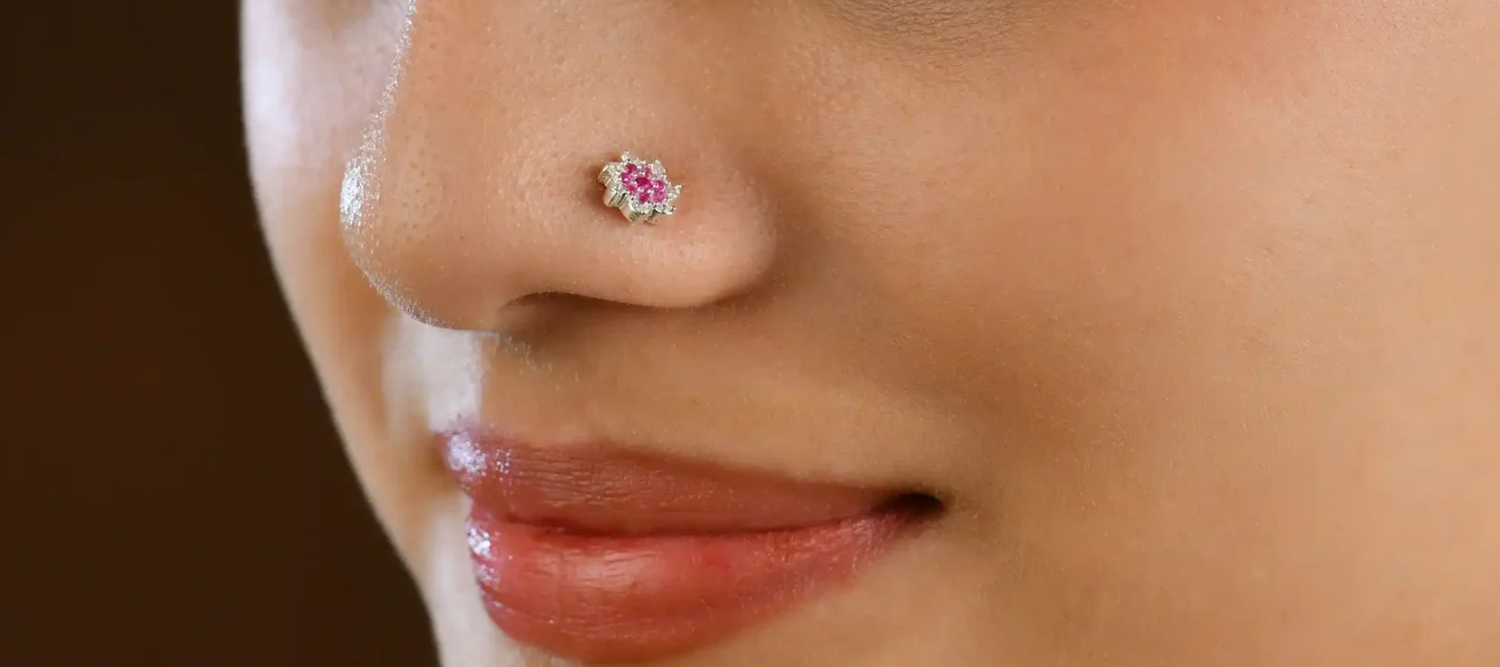 A girl wearing a nose pin