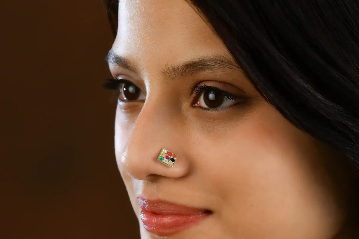 A girl wearing a nose pin