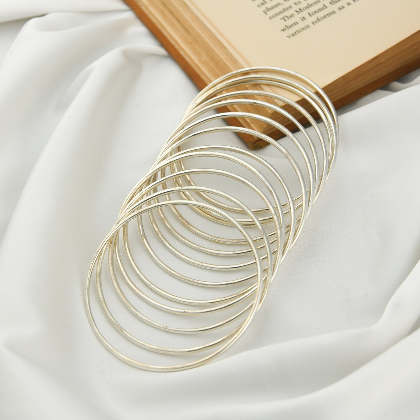 Set Of Dozen Silver Bangles