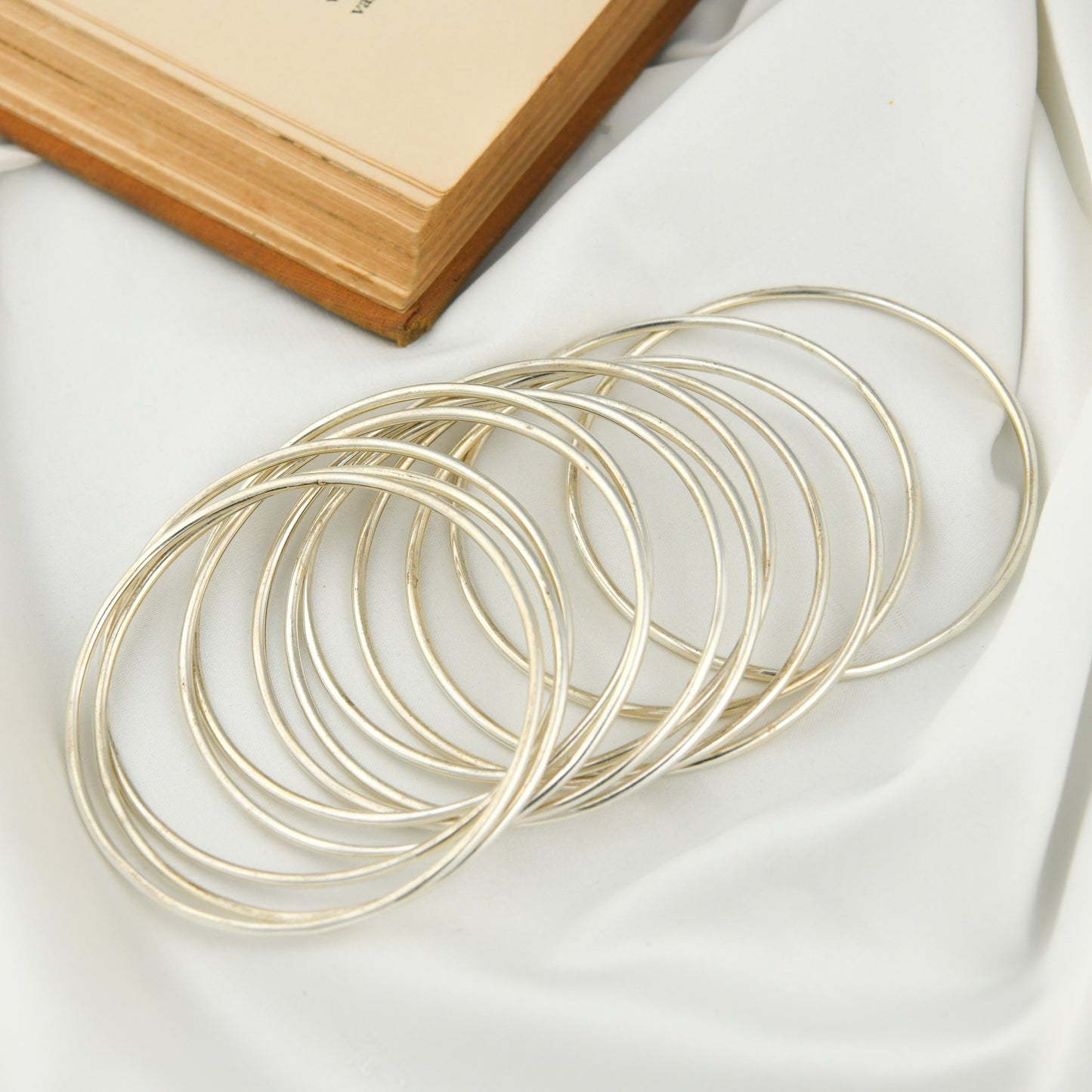 Set Of Dozen Silver Bangles